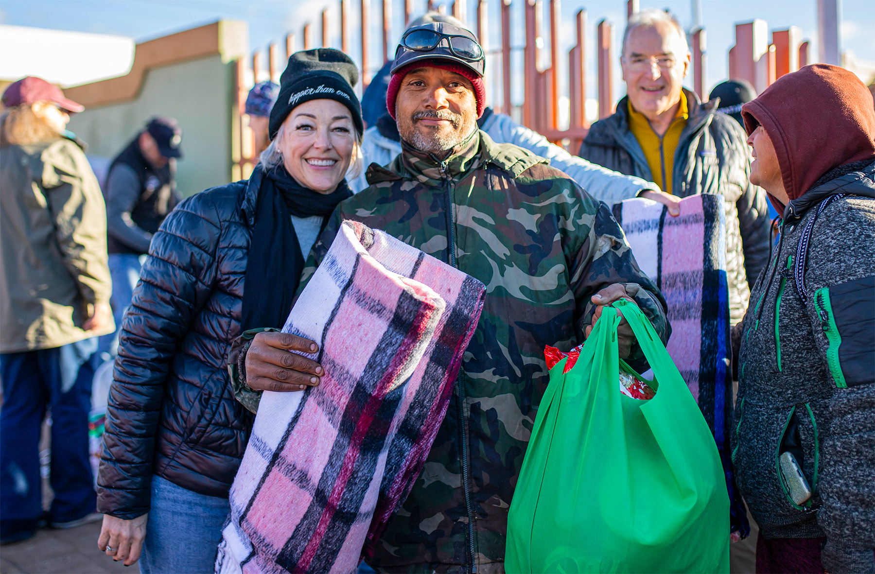 Family receiving assistance from Rancho Feliz volunteers